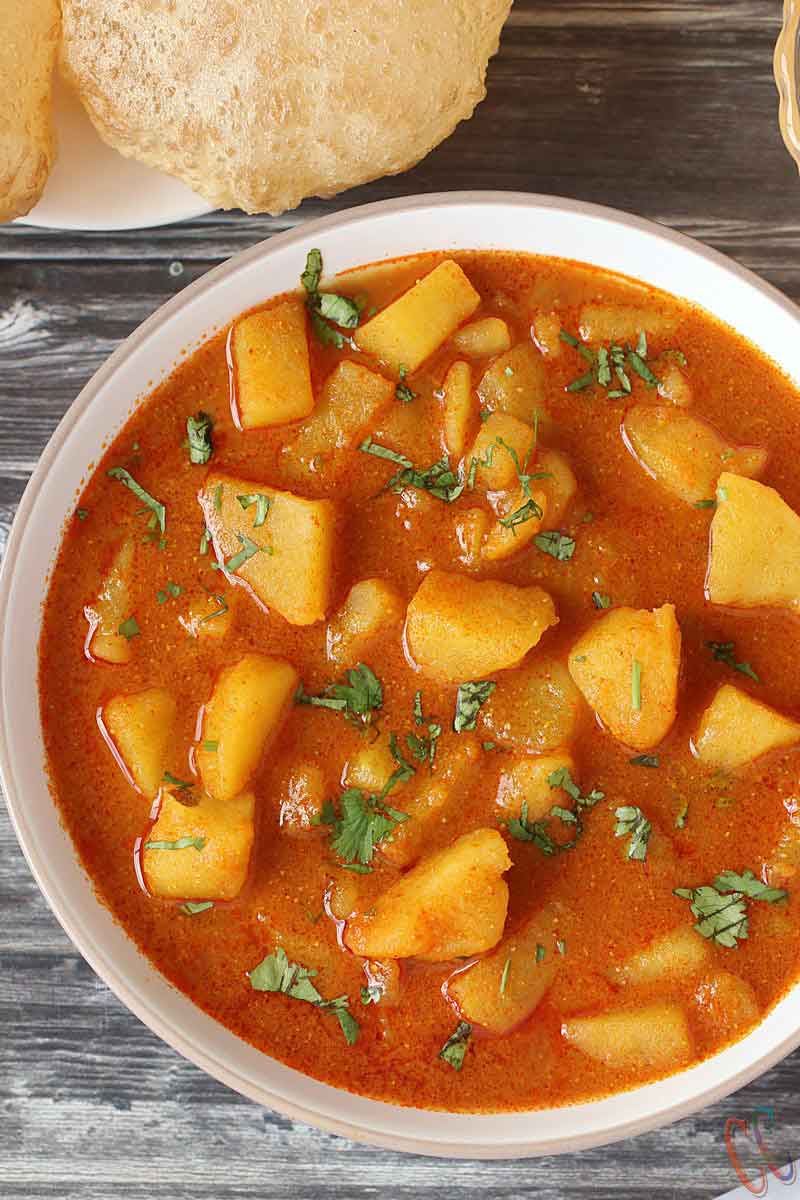 Bateta Nu Rasavalu Shak | Simple Vegan Potato curry is very common sabzi in every Gujarati thali. It is traditional Gujarati Side dish.