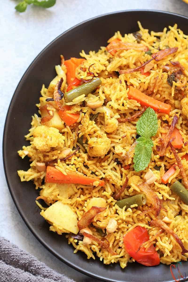 Instant Pot Vegetable Biryani - A mouth watering, bold, flavorful, universally loved Indian One Pot Rice Dish which is packed with vegetables and flavorsome spices. Biryanis are one of the most royal and grand rice based dish from Indian Cuisine.