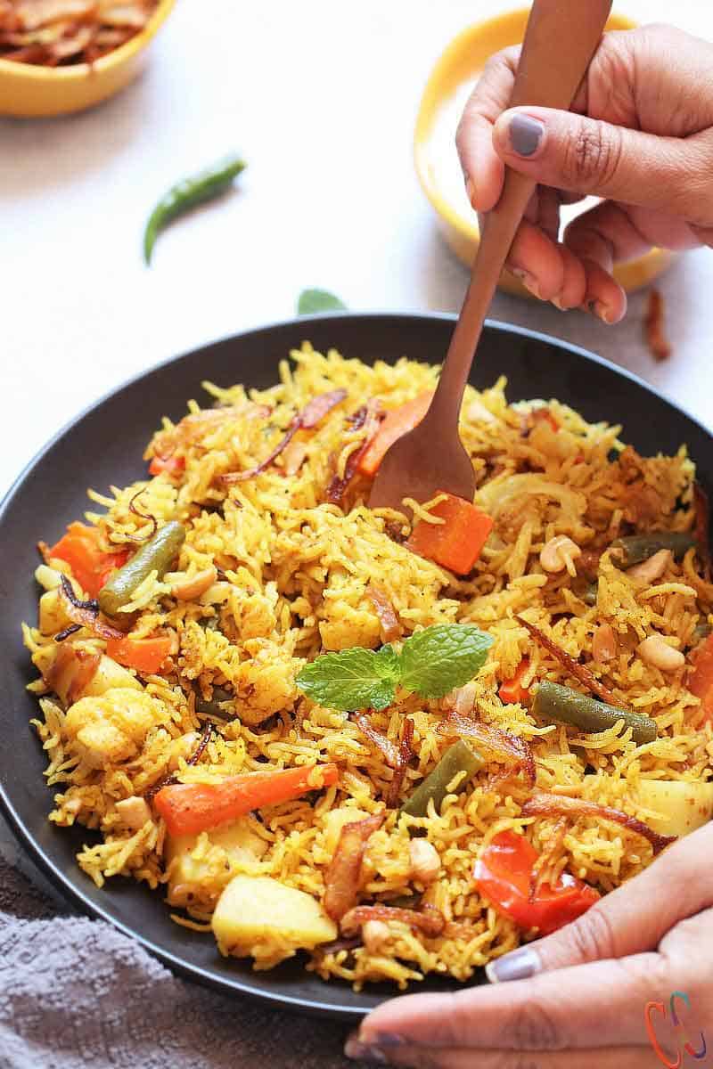 Instant Pot Vegetable Biryani - A mouth watering, bold, flavorful, universally loved Indian One Pot Rice Dish which is packed with vegetables and flavorsome spices. Biryanis are one of the most royal and grand rice based dish from Indian Cuisine.