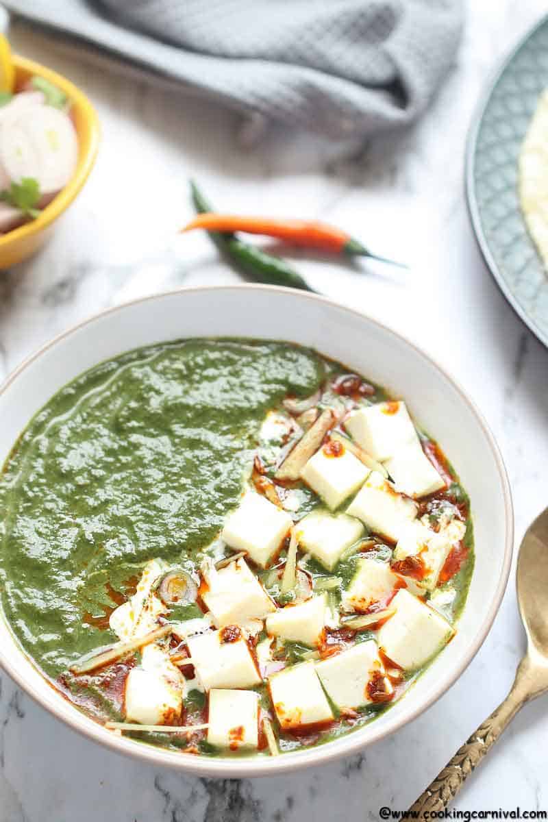 Instant Pot Palak Paneer - Indian Cottage Cheese in Smooth, luscious, Delicious, Creamy Spinach Gravy. Palak Paneer is one of the most loved North Indian Dishes across the world. It is Eaten with Roti, Paratha, Naan, Parotta or Rice. This Vegetarian Indian Instant Pot Recipe is a healthy weeknight dinner recipe that's naturally gluten free, paleo and can easily be made Vegan by using tofu instead of Paneer and Oil instant of Ghee/clarified butter.