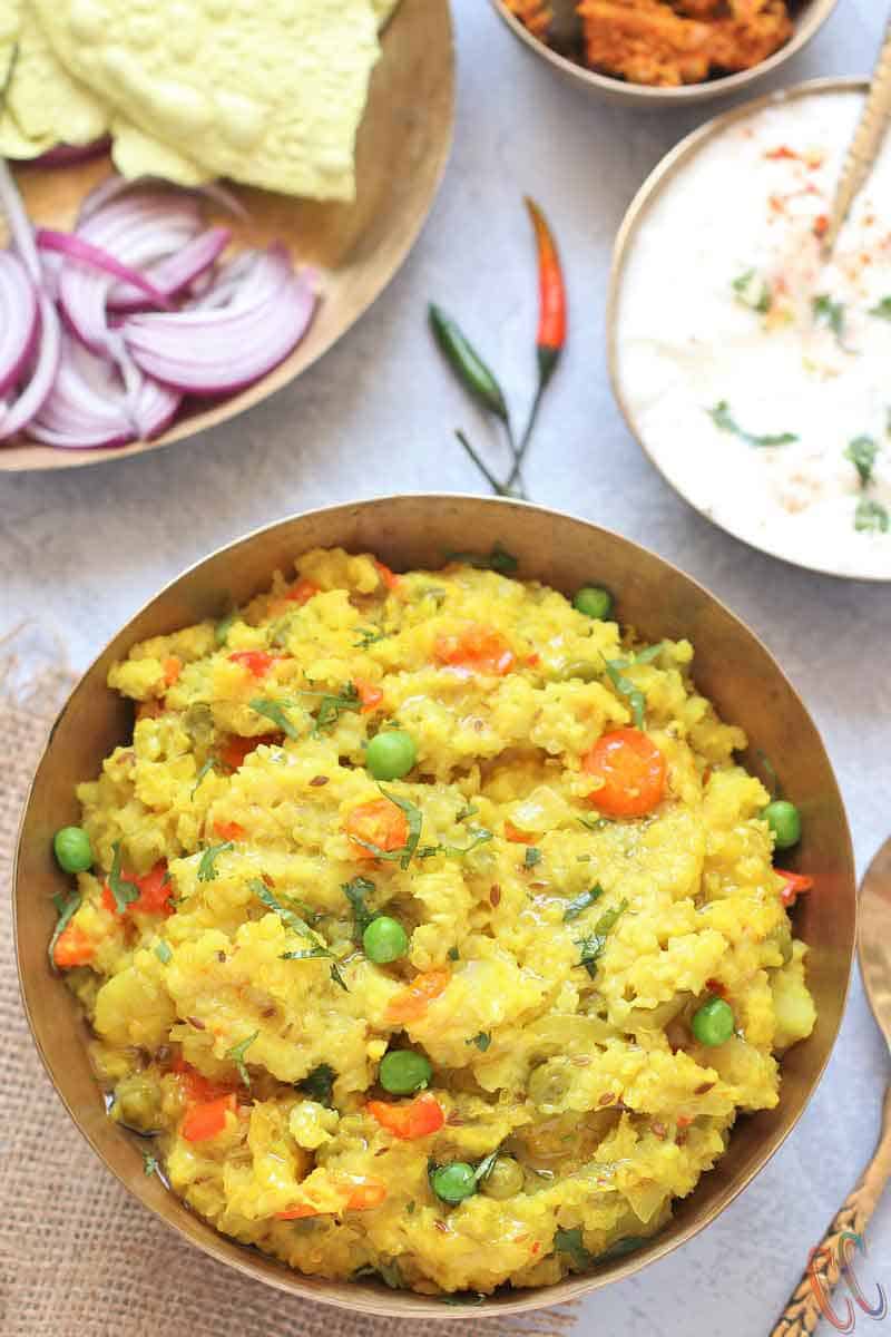 Instant Pot Quinoa Dal Khichdi - Healthy, easy to digest, wholesome, one pot comfort meal prepared by pressure cooking Quinoa, Moong Dal and Rice with lots vegetables and couple of spices. Whether you call it Masala Khichdi, Vaghareli Khichdi, Vegetable or Dal Khichdi, this one pot meal recipe is nutritious and light on the tummy.