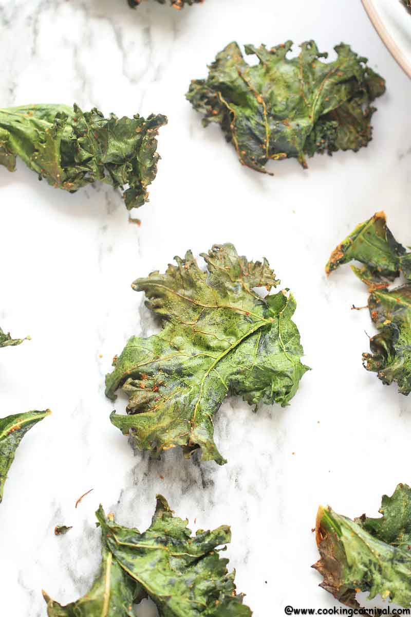 Baked Kale Chips - Simple, tasty, healthy, Flavorful and versatile snack that can be made at home very easily! These are very addicting healthy snack recipe. Once you start munching on them, you won't stop! So let's learn How To Make Kale Chips In the Oven. :)