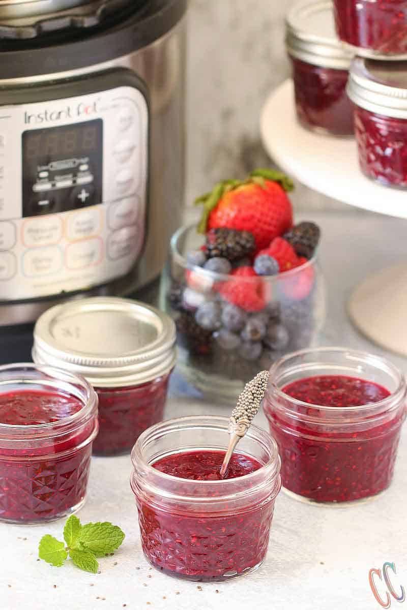 Homemade Instant Pot Chia seed Mixed Berry Jam - Delicious, easy, 100% better than store bought, pectin free Jam recipe with Strawberry, Raspberry, Blueberry and blackberry. Top It up on pancakes, toasts, waffles, Ice-cream or eat it right from the jar! This Mixed Berry Instant Pot Jam Recipe makes a wonderful addition to a yogurt parfait too.