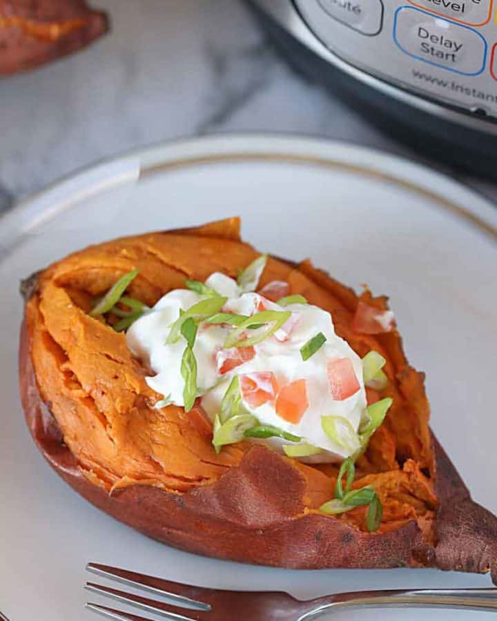sweet potatoes loaded with sour cream, onion and tomatoes.