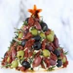 Antipasto Cheese Ball Christmas Tree on a cake stand