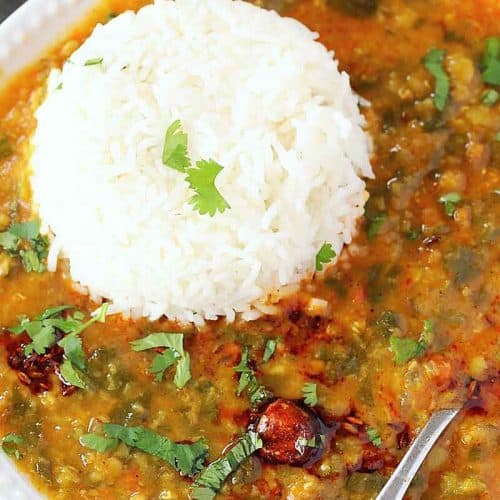 Dal palak on white plate with steamed rice