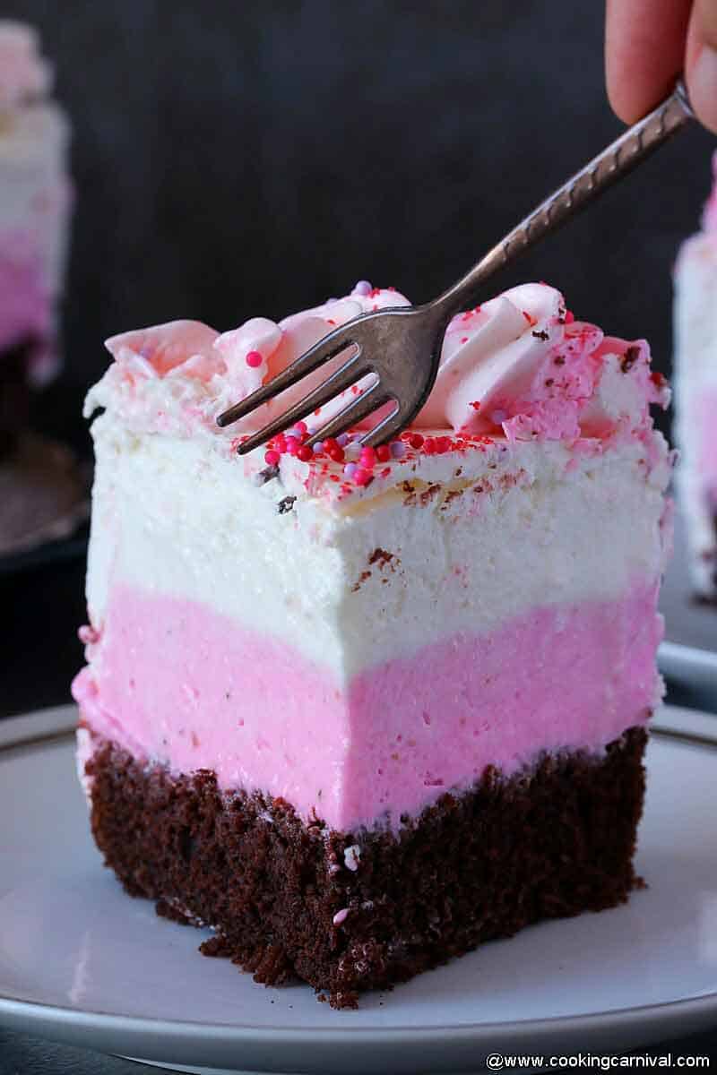 eating ice cream cake with a fork