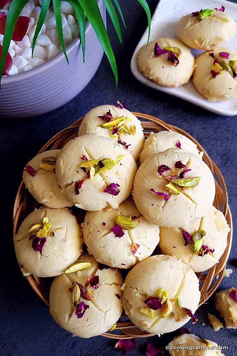 Eggless nankhatai cookies served in a round basket.