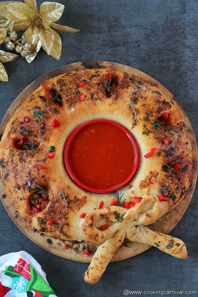 Mexican Stromboli Christmas Wreath Appetizer on a baking stone