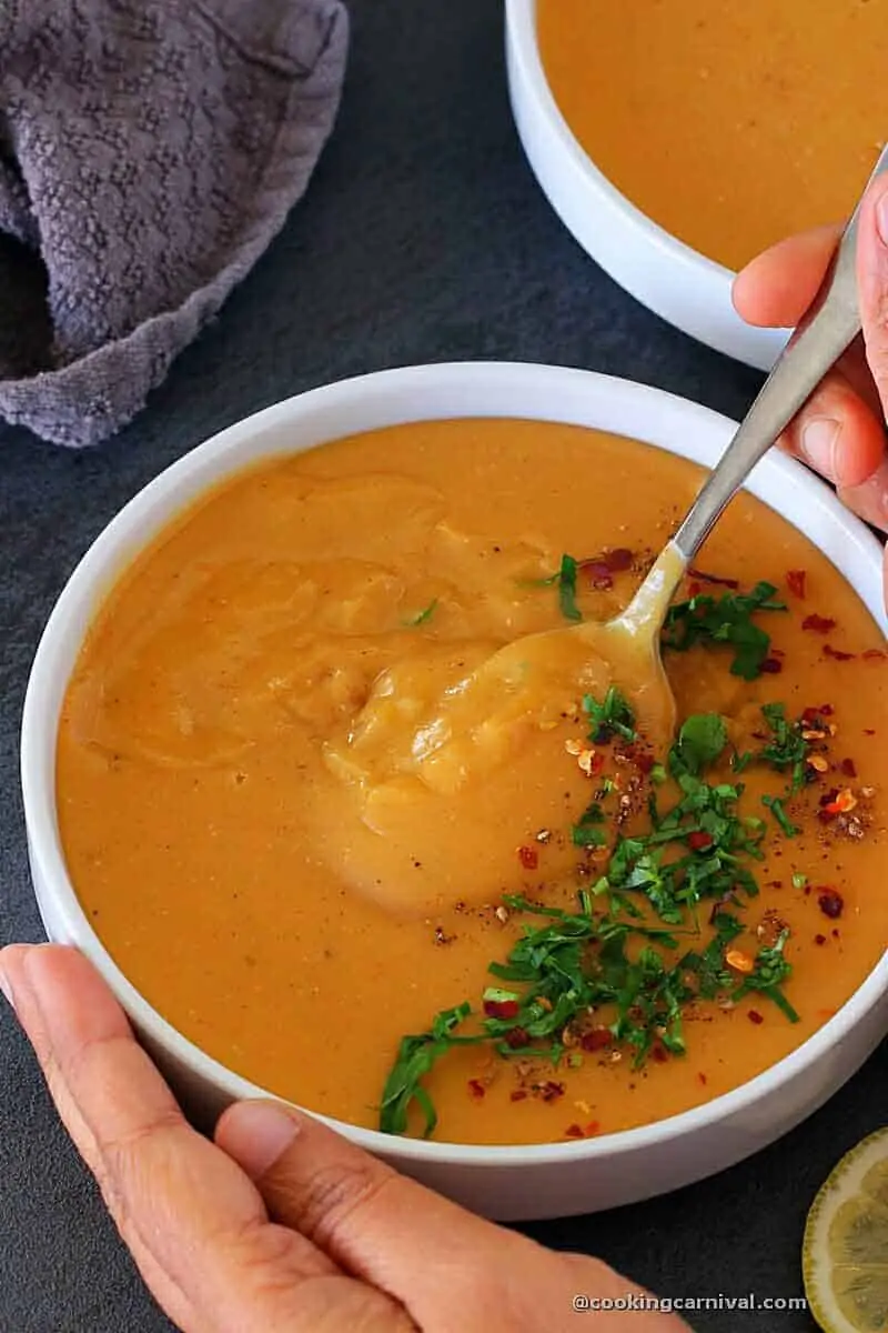 taking Lebanese Lentil Soup with spoon