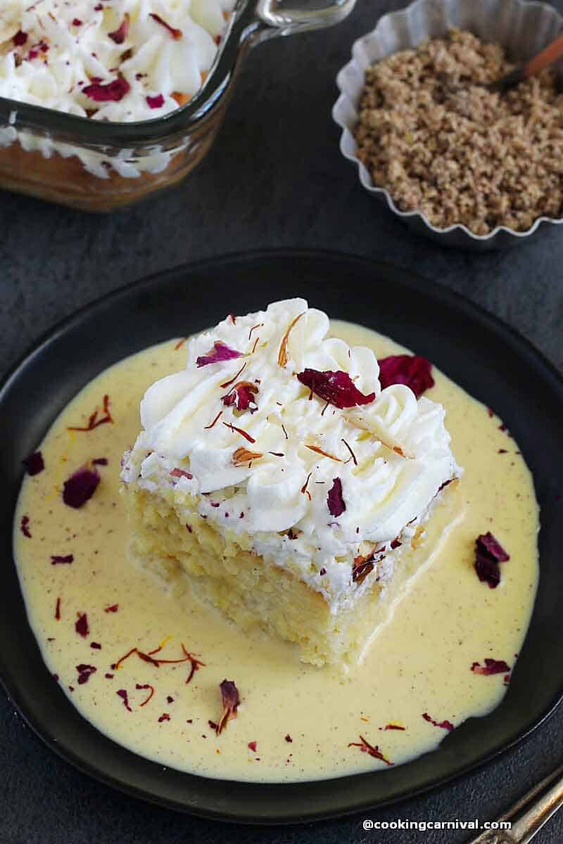 Thandai tres leches cake in a black plate