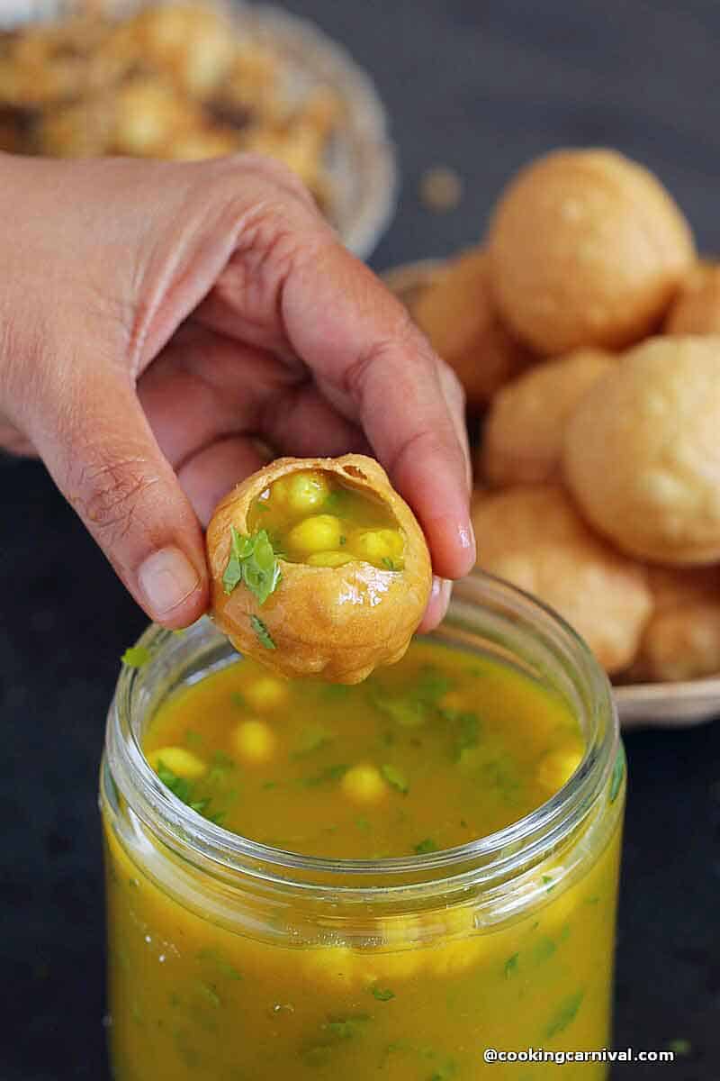 puri filled with potato stuffing and pani