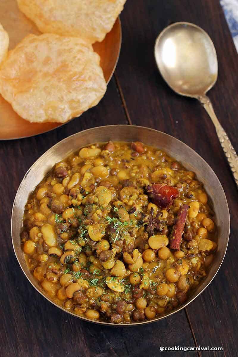 Mix kathol sabji recipe in a traditional bowl, served with puri.