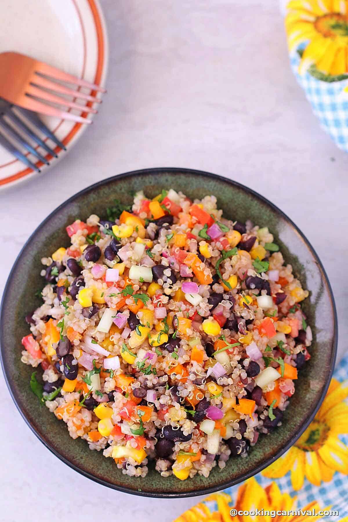 Black Bean Quinoa Salad with lemon dressing, served in a bowl.