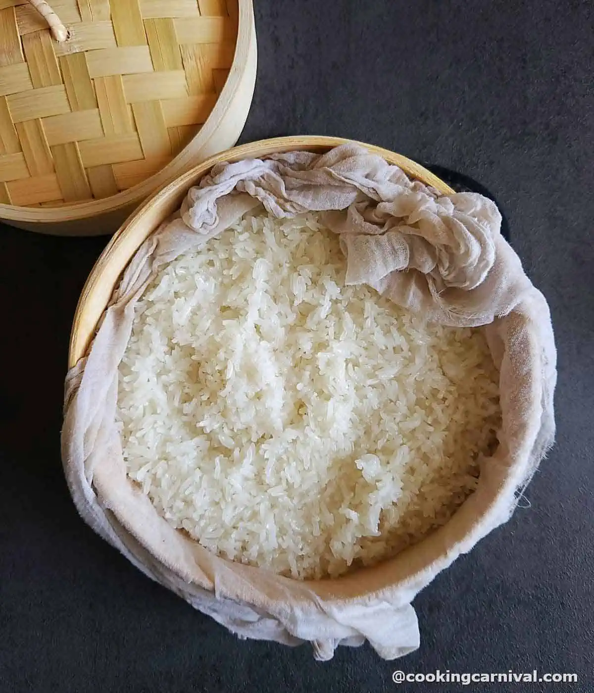steamed sticky rice in a bamboo steamer