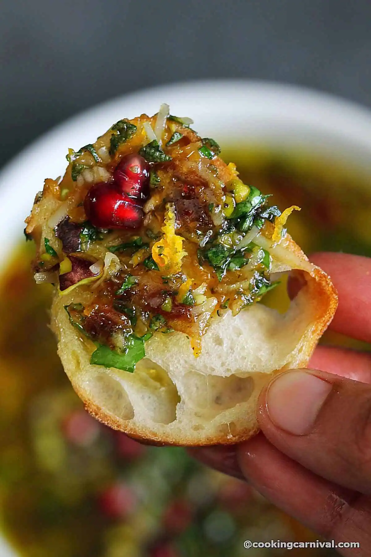 crusty bread dipped in holiday bread dipping oil.