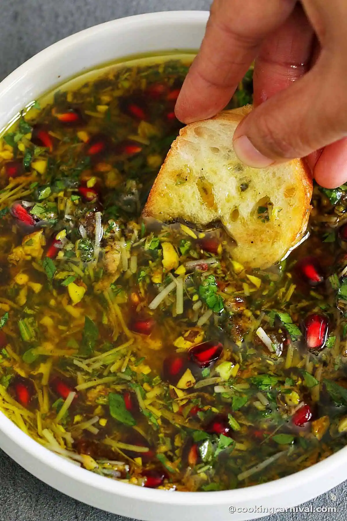 Dipping crusty bread in a holiday-flavored olive oil.