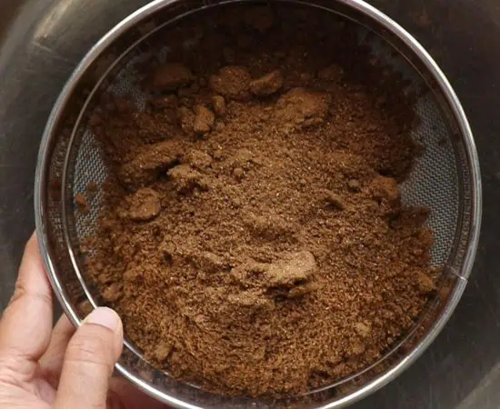 Sieving the garam masala.