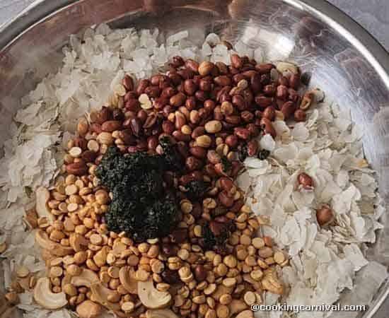 mixing all the pani puri poha ingredients in a bowl.
