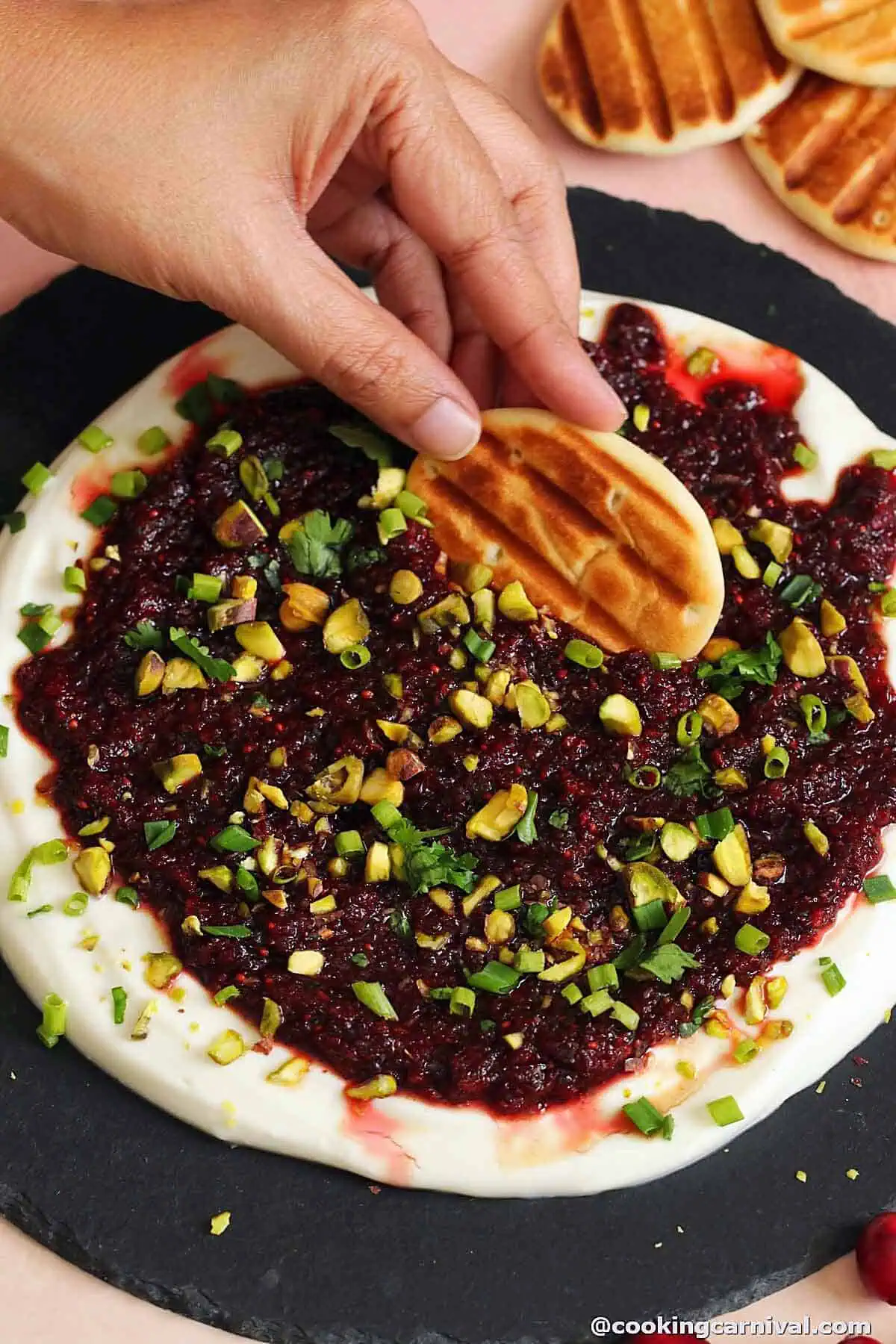 taking cranberry salsa and whipped ricotta with toasted naan bites.