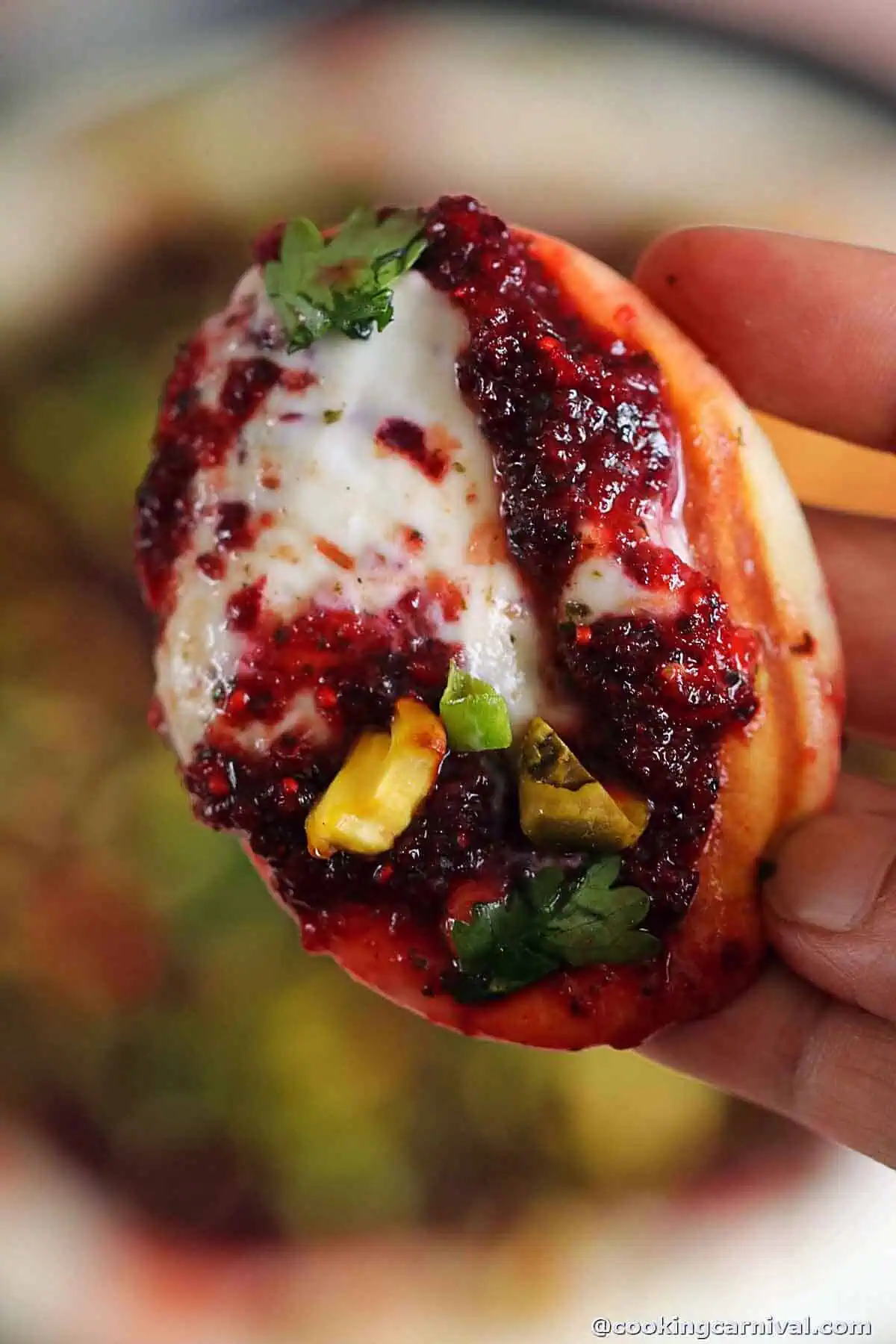 naan bite with whipped ricotta and goat cheese with cranberry salsa.
