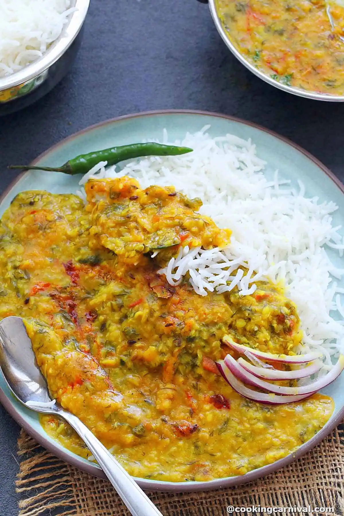 shepu moong dal served with rice on a plate.