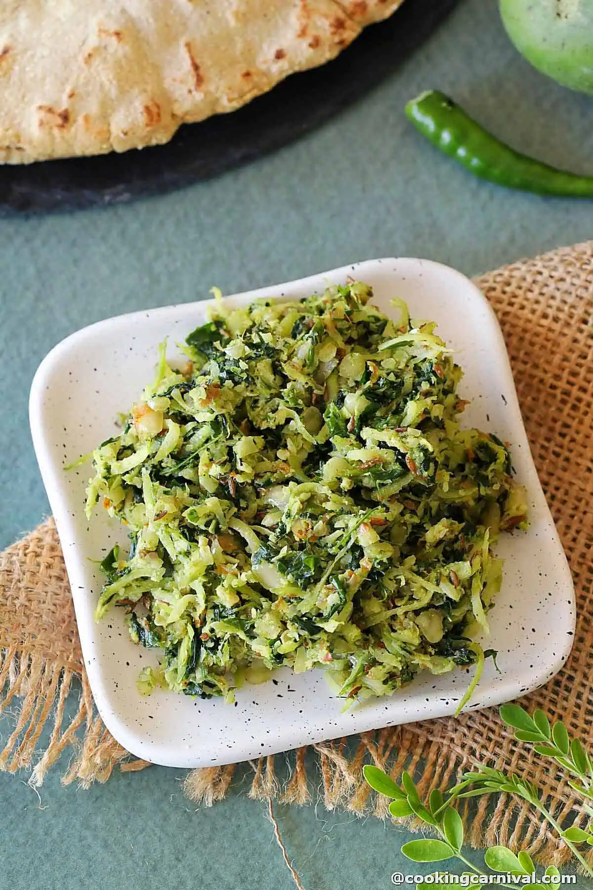 Moringa raw mango thecha on a small plate.