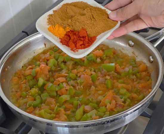 add pav bhaji masala, turmeric powder, chili powder.